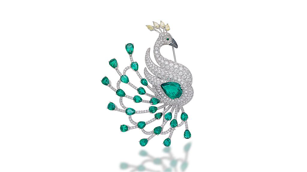A Picchiotti “Masterpieces” peacock brooch, set with 24 pear-cut Zambian emeralds (about 20 carats), four pear-cut fancy yellow diamonds (1.03 carats) and round diamonds (8.91 carats), topped with a hematite beak (price available upon request). 20230626_4-Animal Jewelry.jpg